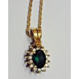 18K gold, emerald coloured stone and dia