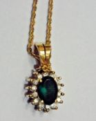 18K gold, emerald coloured stone and dia