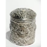 Indian silver canister with raised flora