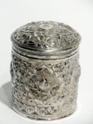 Indian silver canister with raised flora