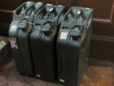 Three large green petrol cans