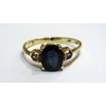 14K gold and blue stone ring, set oval f