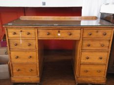 Satin walnut pedestal kneehole desk, the