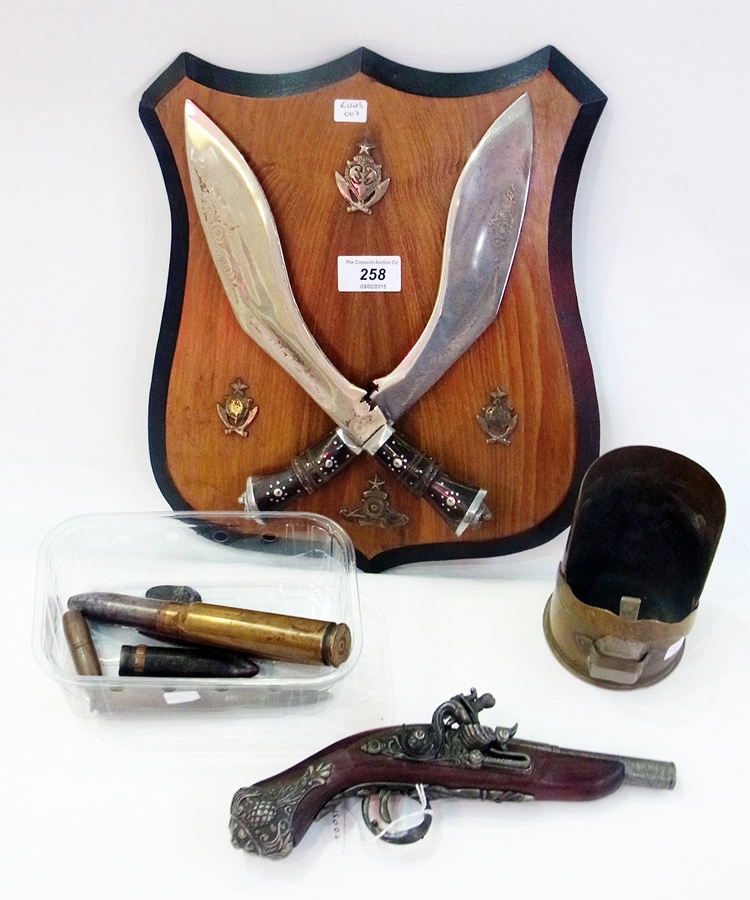 Pair Eastern knives mounted on shield-sh