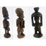 Three various African carved wooden figu
