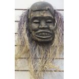Nigerian carved wooden mask with straw h