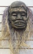 Nigerian carved wooden mask with straw h