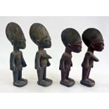 Two pairs of carved wooden Nigerian male