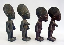 Two pairs of carved wooden Nigerian male