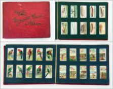 Red cigarette card album including Playe