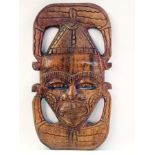 African carved wood wall masks, each hea