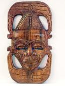 African carved wood wall masks, each hea