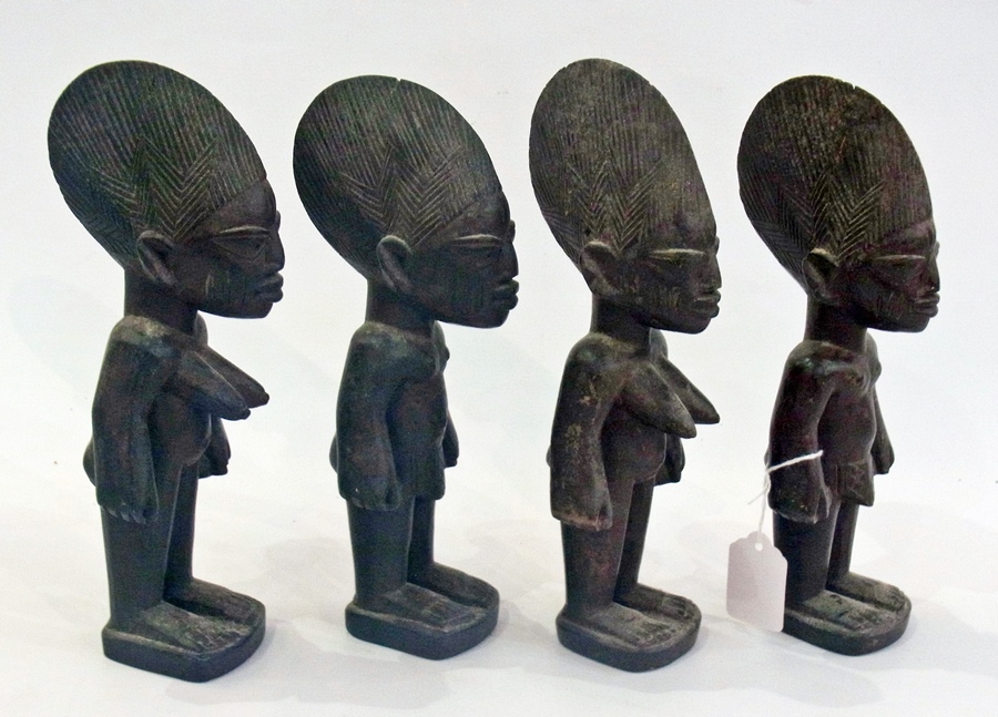 Two pairs of carved wooden Nigerian male