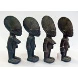 Two pairs of carved wooden Nigerian male