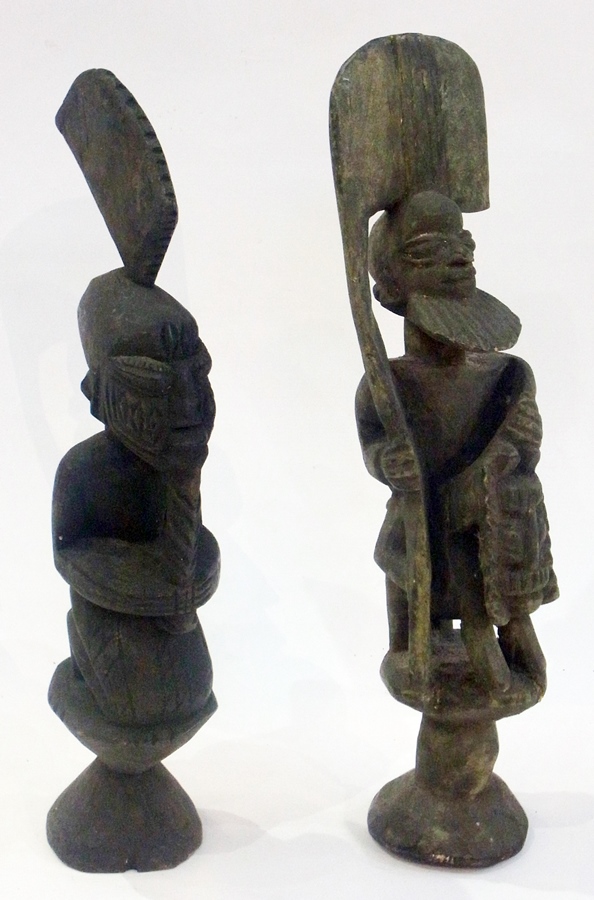 Two African carved male figures, both wi