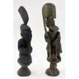 Two African carved male figures, both wi