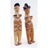 Two pairs of carved wooden Nigerian male