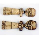 Two African carved bone female figures,
