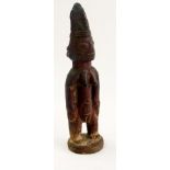 African carved female figure with ornate