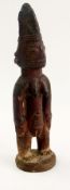 African carved female figure with ornate