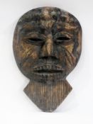 African carved hardwood mask having bead