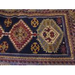 Persian style wool rug decorated with cr