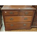 Walnut chest of two short and two long d