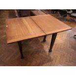 Oak dining table with fold-over hinged t