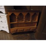 Stained pine wall-hanging shelf rack wit