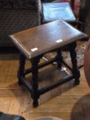 Reproduction oak stool with carved and i