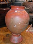 Large terracotta vase on stand, shoulder