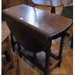 Oak gate-leg dining table, oval on spira