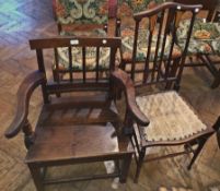 Antique oak carver's open armchair, lath