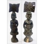 Two carved wooden African female sculptu