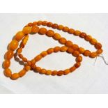 An amber type necklace, approx. weight 28.3g