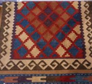 Kelim runner decorated to a central red