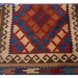 Kelim runner decorated to a central red