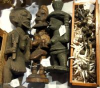 Three African carved wood figures and a