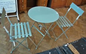 Green painted metal folding garden table