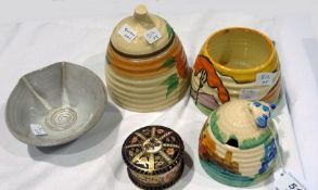 Three Clarice Cliff honey pots, one with