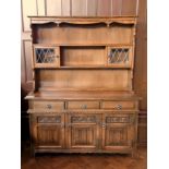 A modern reproduction oak dresser, the o