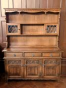 A modern reproduction oak dresser, the o