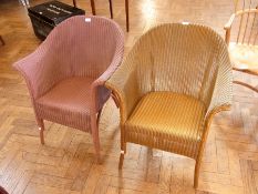 Two Lloyd Loom "Lusty" tub armchairs, on