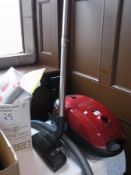 A Miele S2111 vacuum cleaner together wi