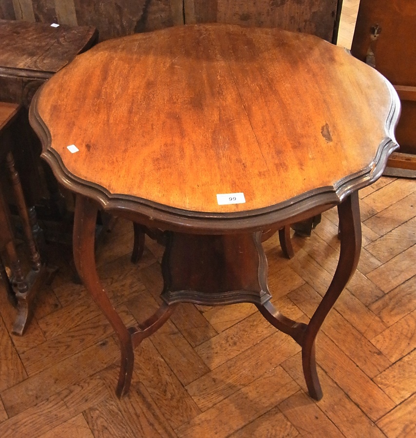 An Edwardian mahogany occasional table w