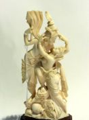 Eastern carved ivory group of two intert