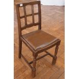 A set of four oak bar-back dining chairs