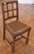 A set of four oak bar-back dining chairs