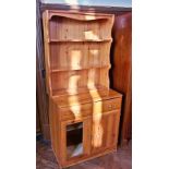 A modern pine dresser with a two shelf o