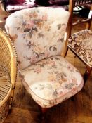 Fireside chair with curved button back,